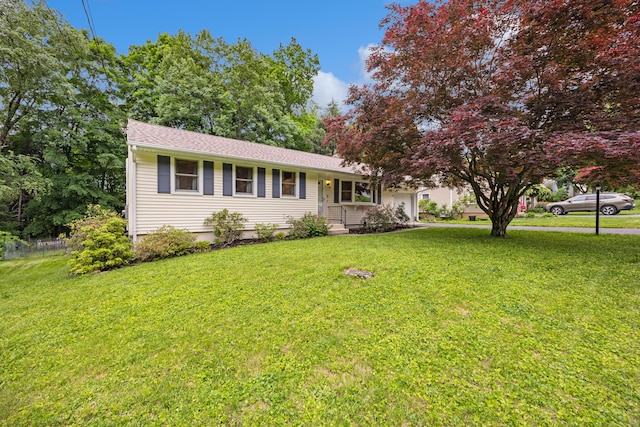 55 Andrasko Rd, Beacon Falls, CT 06403 - view of front of home featuring a front lawn, a garage, and roof with shingles
