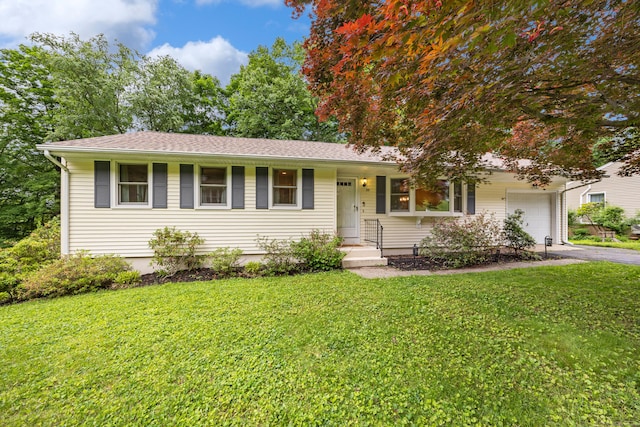 55 Andrasko Rd, Beacon Falls, CT 06403 - ranch-style house featuring driveway, an attached garage, and a front lawn