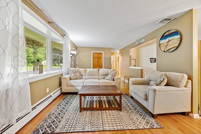 55 Andrasko Rd, Beacon Falls, CT 06403 - living room featuring light wood finished floors, a baseboard heating unit, and baseboards