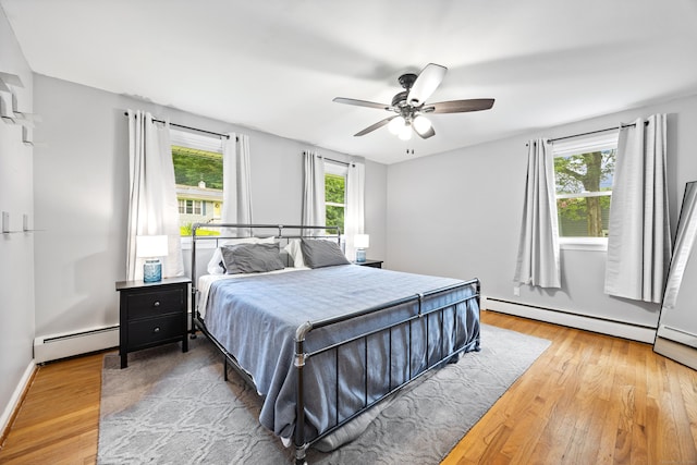 55 Andrasko Rd, Beacon Falls, CT 06403 - bedroom with a baseboard radiator, light wood-style flooring, and ceiling fan