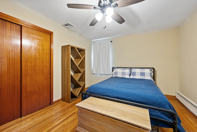 55 Andrasko Rd, Beacon Falls, CT 06403 - bedroom featuring a baseboard heating unit, light wood finished floors, ceiling fan, and baseboards