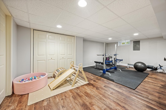55 Andrasko Rd, Beacon Falls, CT 06403 - workout area featuring wood finished floors, electric panel, a drop ceiling, recessed lighting, and baseboards
