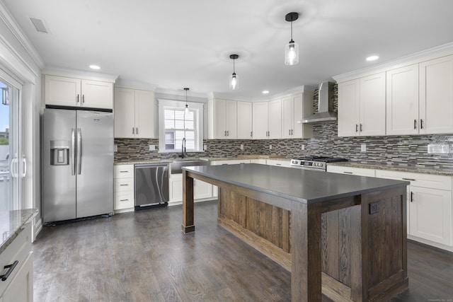 864 Baldwin St, Waterbury, CT 06706 - kitchen featuring stainless steel appliances, wall chimney exhaust hood, backsplash, a sink, and recessed lighting