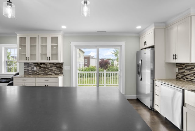 864 Baldwin St, Waterbury, CT 06706 - kitchen featuring stainless steel appliances, white cabinetry, decorative backsplash, healthy amount of natural light, and crown molding
