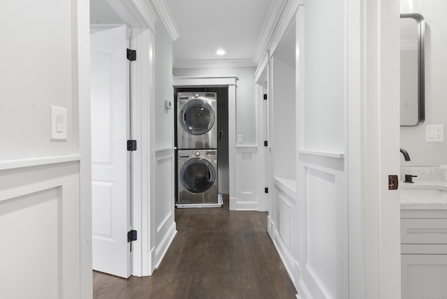864 Baldwin St, Waterbury, CT 06706 - laundry area featuring estacked washer and dryer, dark wood-style floors, crown molding, and recessed lighting