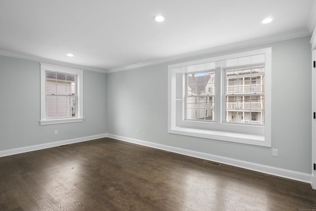864 Baldwin St, Waterbury, CT 06706 - empty room with crown molding, baseboards, dark wood-style flooring, and recessed lighting