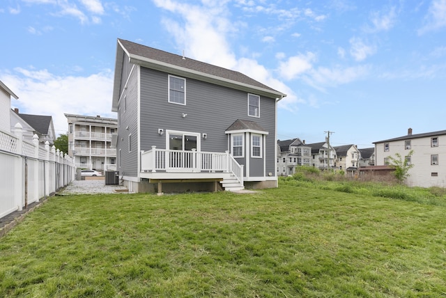 864 Baldwin St, Waterbury, CT 06706 - back of property featuring central AC unit, a wooden deck, and a residential view