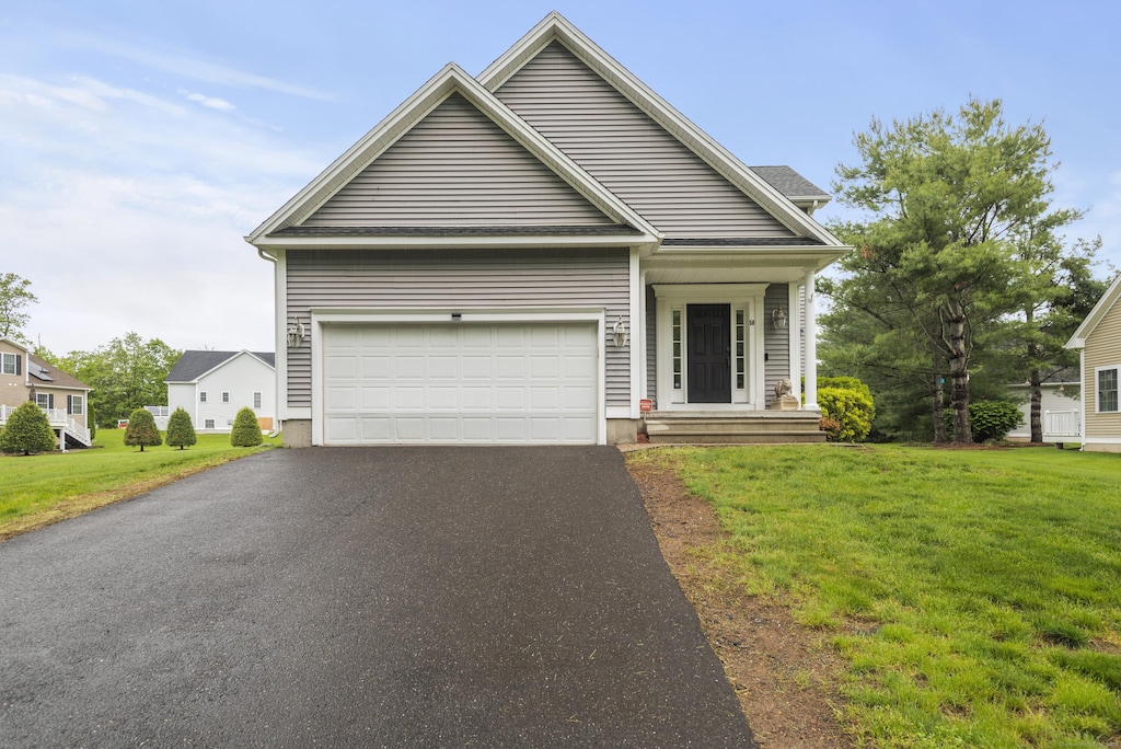 50 Silver Island Way Unit 50, Berlin, CT 06037 - view of front facade with driveway, a front lawn, and an attached garage