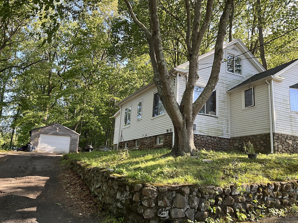 148 Burwell Rd, West Haven, CT 06516 - view of home's exterior with a detached garage and an outbuilding