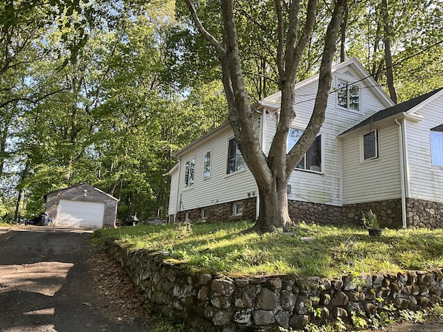 148 Burwell Rd, West Haven, CT 06516 - view of home's exterior with a detached garage and an outbuilding