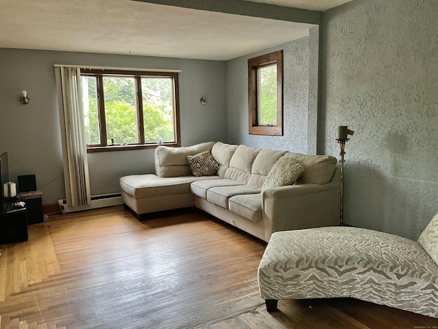 148 Burwell Rd, West Haven, CT 06516 - living area featuring wood finished floors and a baseboard radiator