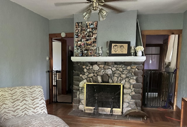 148 Burwell Rd, West Haven, CT 06516 - living room featuring a ceiling fan, wood finished floors, and a stone fireplace