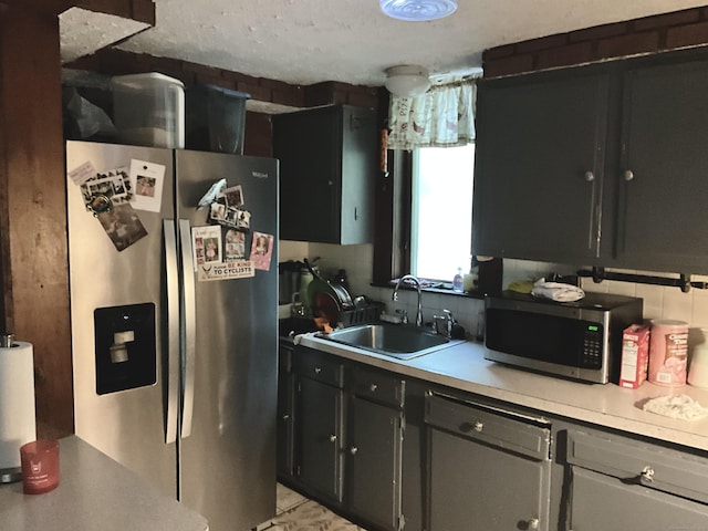 148 Burwell Rd, West Haven, CT 06516 - kitchen featuring appliances with stainless steel finishes, dark cabinetry, and light countertops