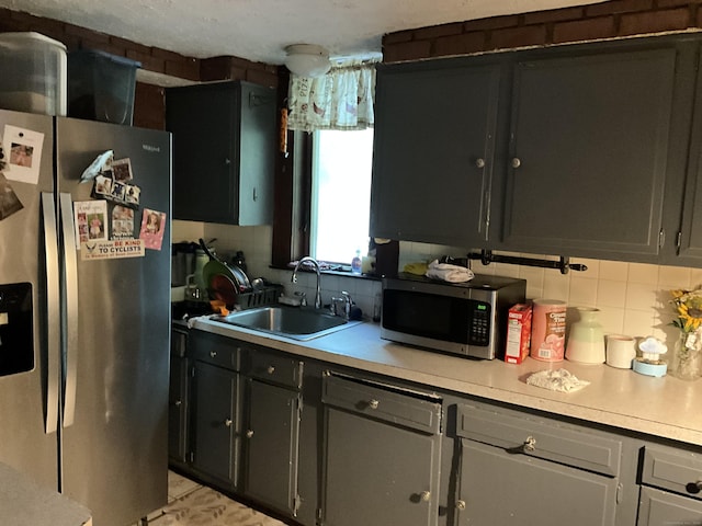 148 Burwell Rd, West Haven, CT 06516 - kitchen with appliances with stainless steel finishes, tasteful backsplash, and light countertops