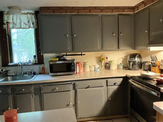 148 Burwell Rd, West Haven, CT 06516 - kitchen featuring stainless steel microwave, electric stove, decorative backsplash, and light countertops