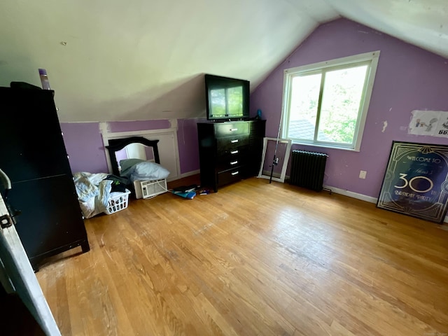 148 Burwell Rd, West Haven, CT 06516 - additional living space with radiator, light wood-type flooring, and vaulted ceiling