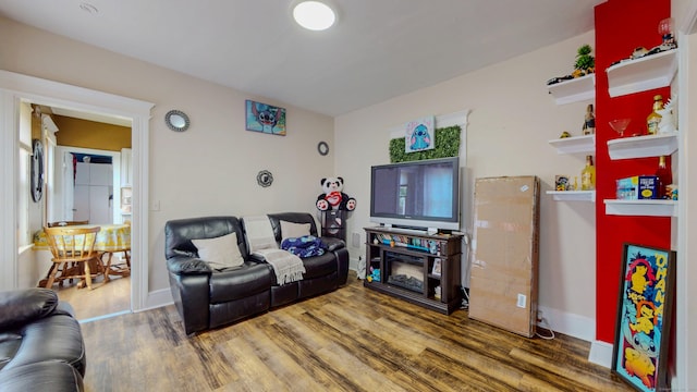 174 Fairview Ave, Bridgeport, CT 06606 - living room with wood finished floors and baseboards