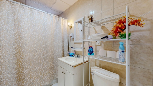 174 Fairview Ave, Bridgeport, CT 06606 - full bath with vanity, tile walls, toilet, and a shower with shower curtain