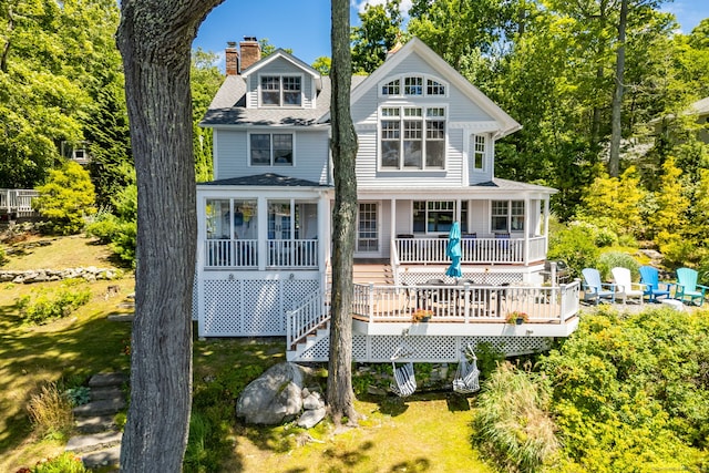 424 E Wakefield Blvd, Winchester, CT 06098 - back of property featuring a chimney, a porch, a shingled roof, and view of wooded area