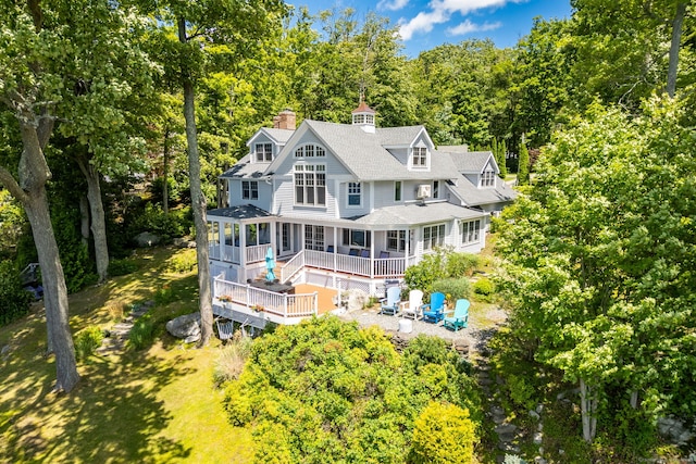 424 E Wakefield Blvd, Winchester, CT 06098 - rear view of house featuring a shingled roof, a chimney, and a patio area