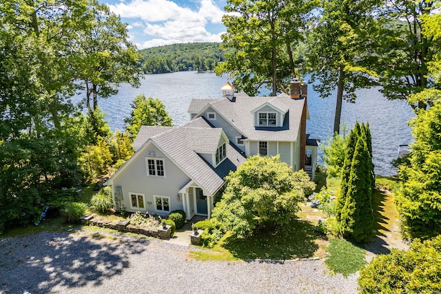 424 E Wakefield Blvd, Winchester, CT 06098 - view of front of home with a water view, a chimney, roof with shingles, and a wooded view