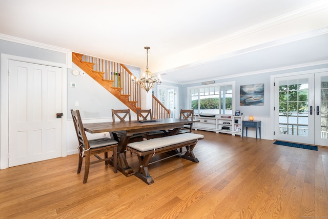 424 E Wakefield Blvd, Winchester, CT 06098 - dining area with stairway, a chandelier, light wood-style flooring, crown molding, and french doors