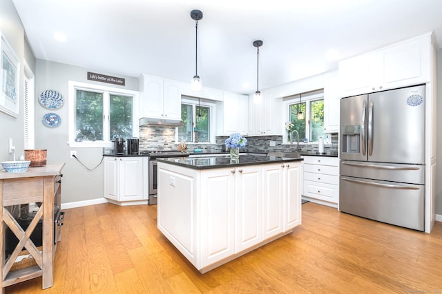 424 E Wakefield Blvd, Winchester, CT 06098 - kitchen featuring stainless steel appliances, light wood-style flooring, decorative backsplash, plenty of natural light, and recessed lighting