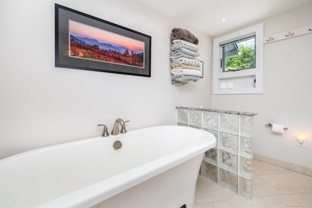 424 E Wakefield Blvd, Winchester, CT 06098 - bathroom featuring a freestanding bath, tile patterned floors, and baseboards