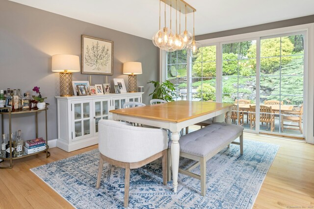6 Queens Ln, Darien, CT 06820 - dining area with light wood-type flooring and a chandelier