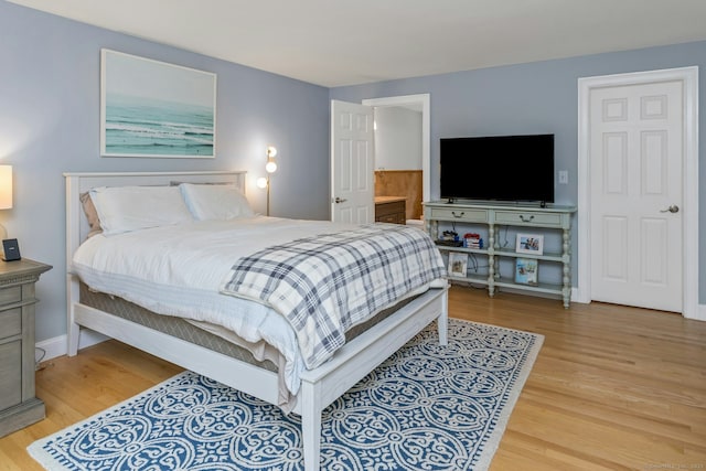 6 Queens Ln, Darien, CT 06820 - bedroom featuring wood finished floors, baseboards, and ensuite bath