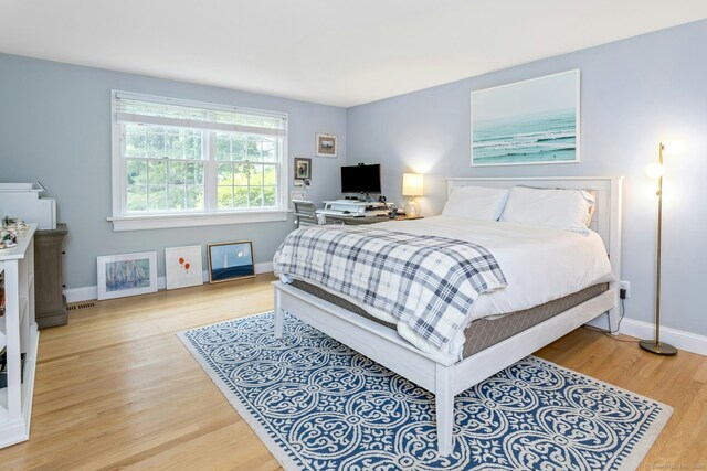6 Queens Ln, Darien, CT 06820 - bedroom featuring light wood-style floors and baseboards