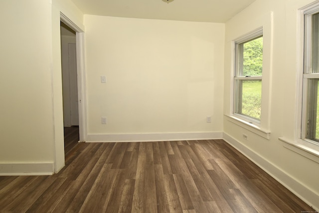 17 Spruce St, Vernon, CT 06066 - empty room with dark wood-style floors, plenty of natural light, and baseboards