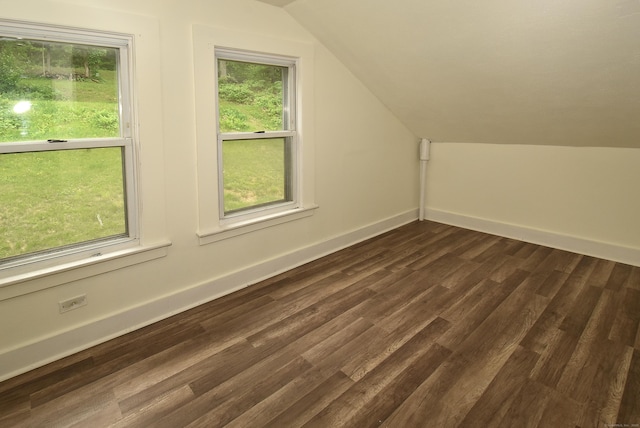 17 Spruce St, Vernon, CT 06066 - additional living space featuring vaulted ceiling, dark wood-style flooring, and baseboards