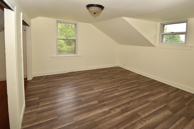 17 Spruce St, Vernon, CT 06066 - bonus room with dark wood finished floors, vaulted ceiling, and baseboards