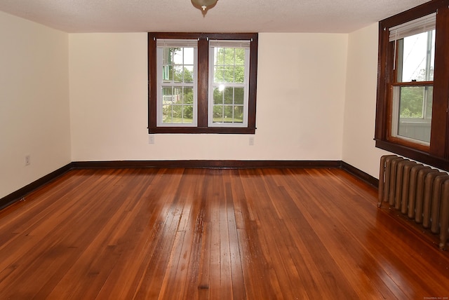 17 Spruce St, Vernon, CT 06066 - spare room with radiator, hardwood / wood-style floors, and baseboards
