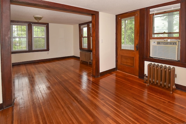 17 Spruce St, Vernon, CT 06066 - empty room featuring radiator, baseboards, and hardwood / wood-style flooring