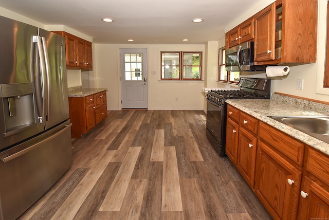 17 Spruce St, Vernon, CT 06066 - kitchen featuring stainless steel appliances, dark wood-type flooring, brown cabinetry, light stone counters, and recessed lighting