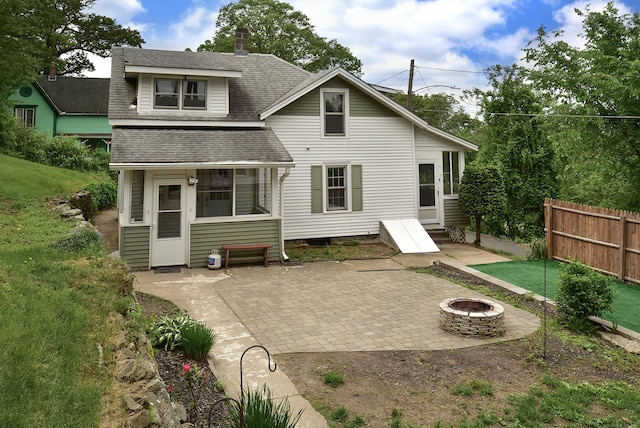 17 Spruce St, Vernon, CT 06066 - rear view of property featuring a patio, a fire pit, and a shingled roof