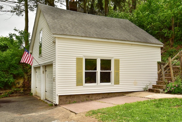 17 Spruce St, Vernon, CT 06066 - view of home's exterior featuring roof with shingles, stairs, a chimney, and a garage