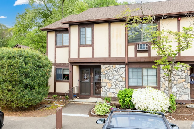 202 Foxwood Ln Unit 202, Milford, CT 06461 - tudor house featuring stucco siding, stone siding, and roof with shingles