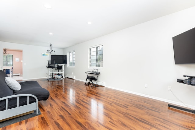 202 Foxwood Ln Unit 202, Milford, CT 06461 - living room featuring a baseboard heating unit, wood finished floors, recessed lighting, baseboards, and a chandelier