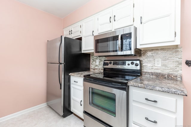 202 Foxwood Ln Unit 202, Milford, CT 06461 - kitchen with stainless steel appliances, white cabinets, backsplash, and baseboards
