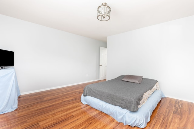 202 Foxwood Ln Unit 202, Milford, CT 06461 - bedroom with wood finished floors and baseboards