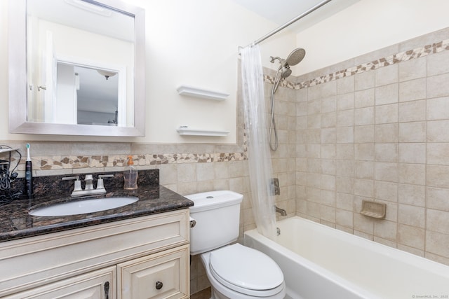202 Foxwood Ln Unit 202, Milford, CT 06461 - full bathroom featuring shower / bath combo, vanity, toilet, tile walls, and wainscoting