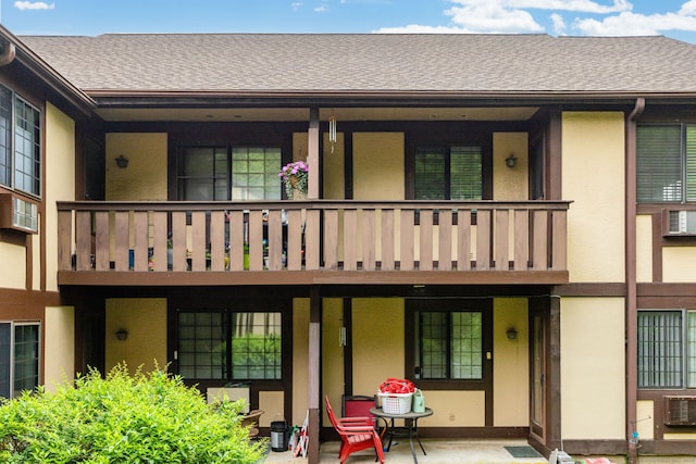 202 Foxwood Ln Unit 202, Milford, CT 06461 - back of house featuring stucco siding and roof with shingles