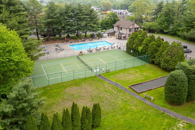 202 Foxwood Ln Unit 202, Milford, CT 06461 - drone / aerial view of a pool area and a tree filled landscape
