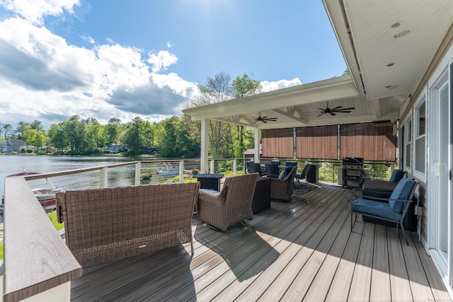 72 Lake View Dr, Woodstock, CT 06281 - wooden terrace with a water view, ceiling fan, and outdoor dining space
