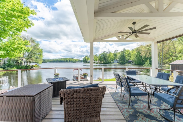 72 Lake View Dr, Woodstock, CT 06281 - view of patio / terrace featuring outdoor dining space, ceiling fan, and a deck with water view
