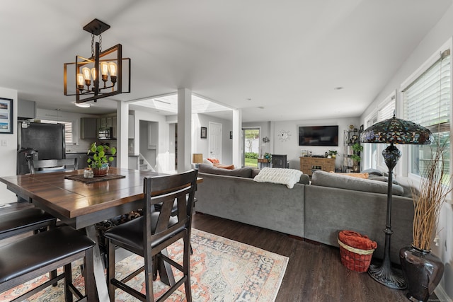 72 Lake View Dr, Woodstock, CT 06281 - dining area with wood finished floors, stairway, and a chandelier