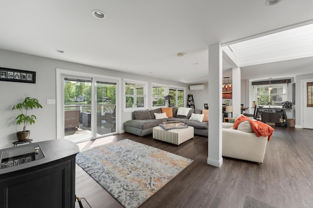 72 Lake View Dr, Woodstock, CT 06281 - living area featuring wood finished floors, a wall unit AC, and recessed lighting